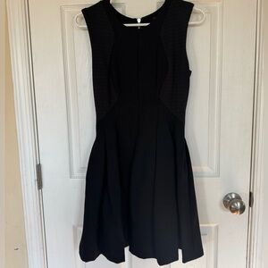 Size small BCBGMaxazria dress, black w/pleats in the skirt and two textured top